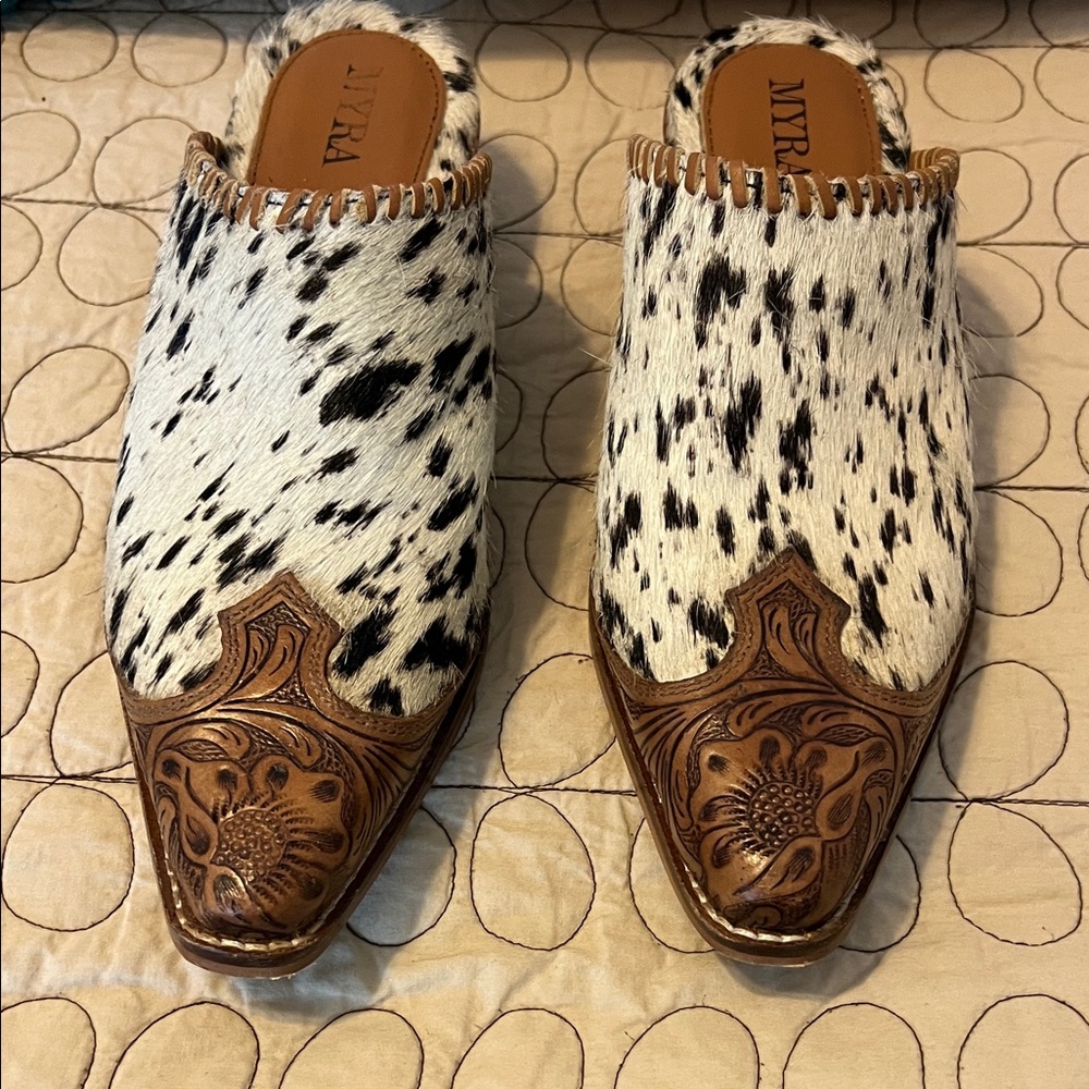 Myra cowhide mules.